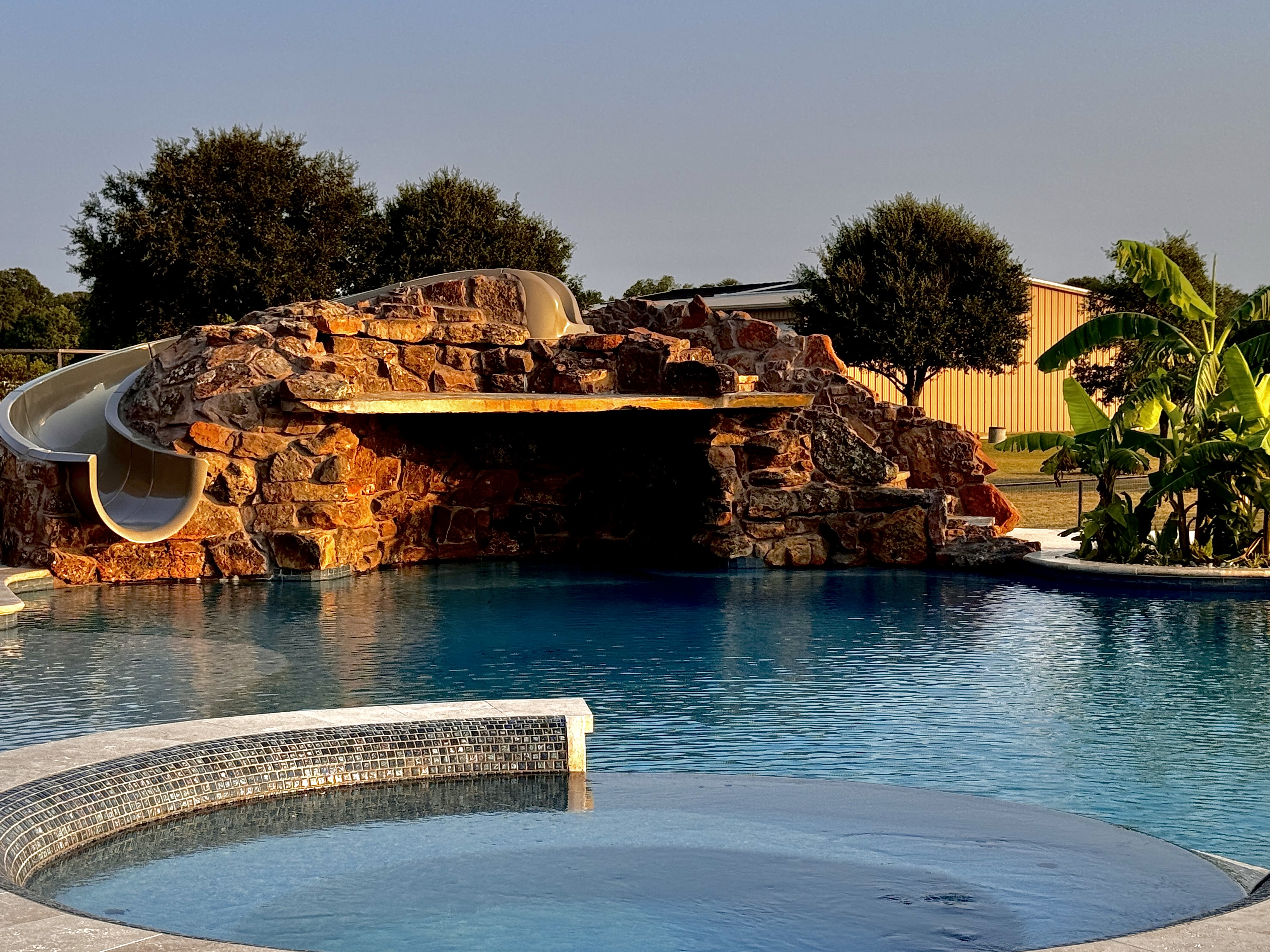 Rock grotto with a slide at golden hour