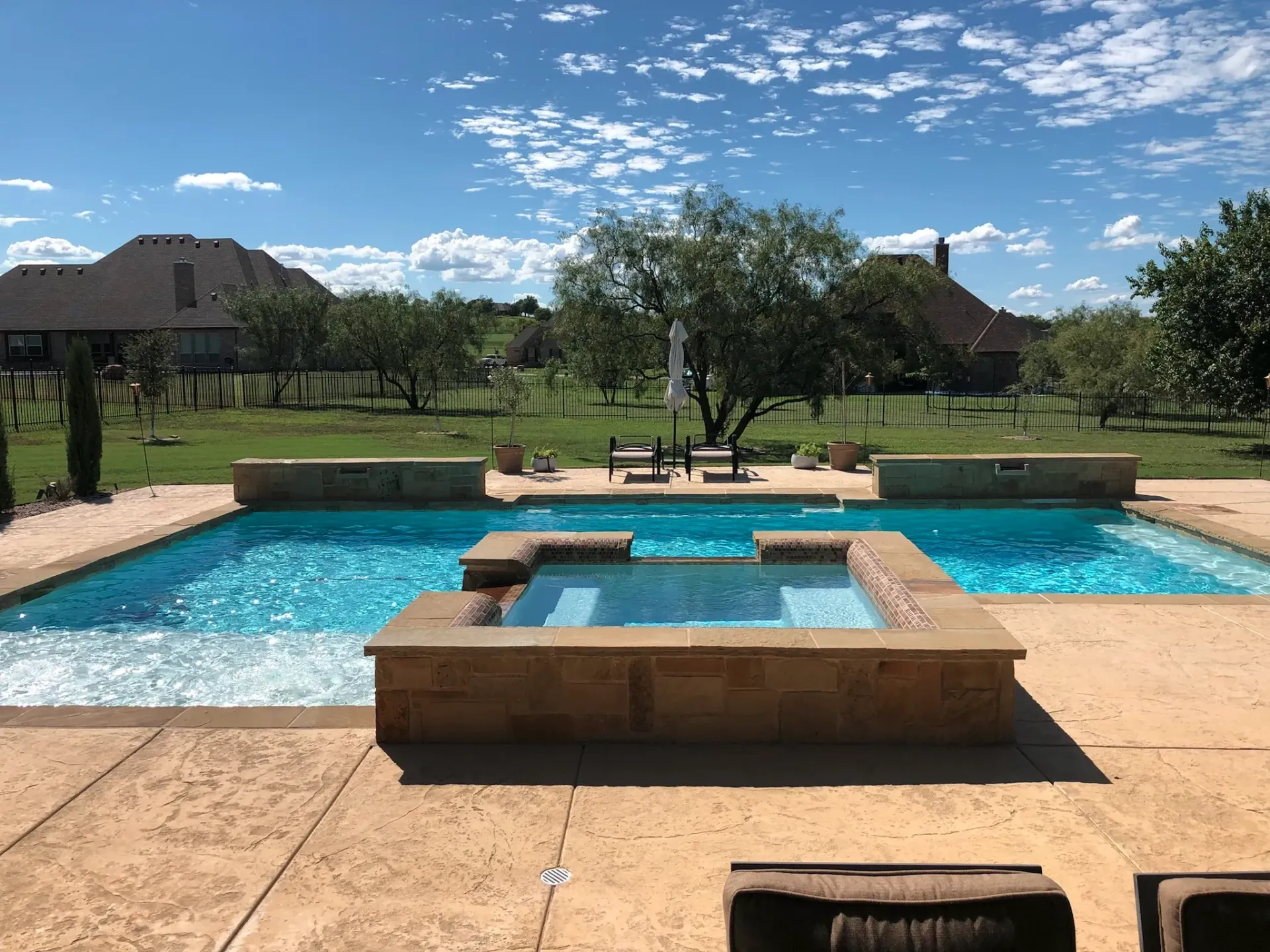 Geometric pool with a raised spa