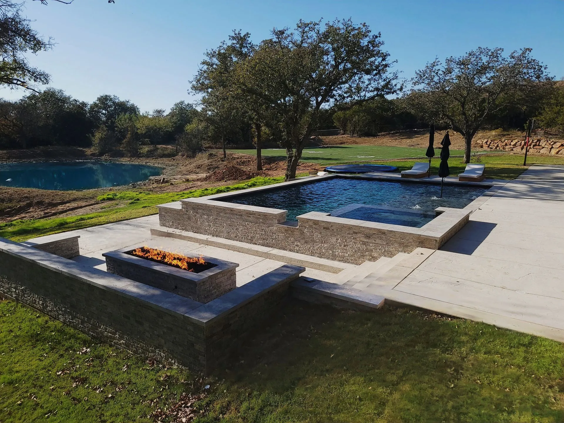 Rural pool with a firepit in Santo, TX