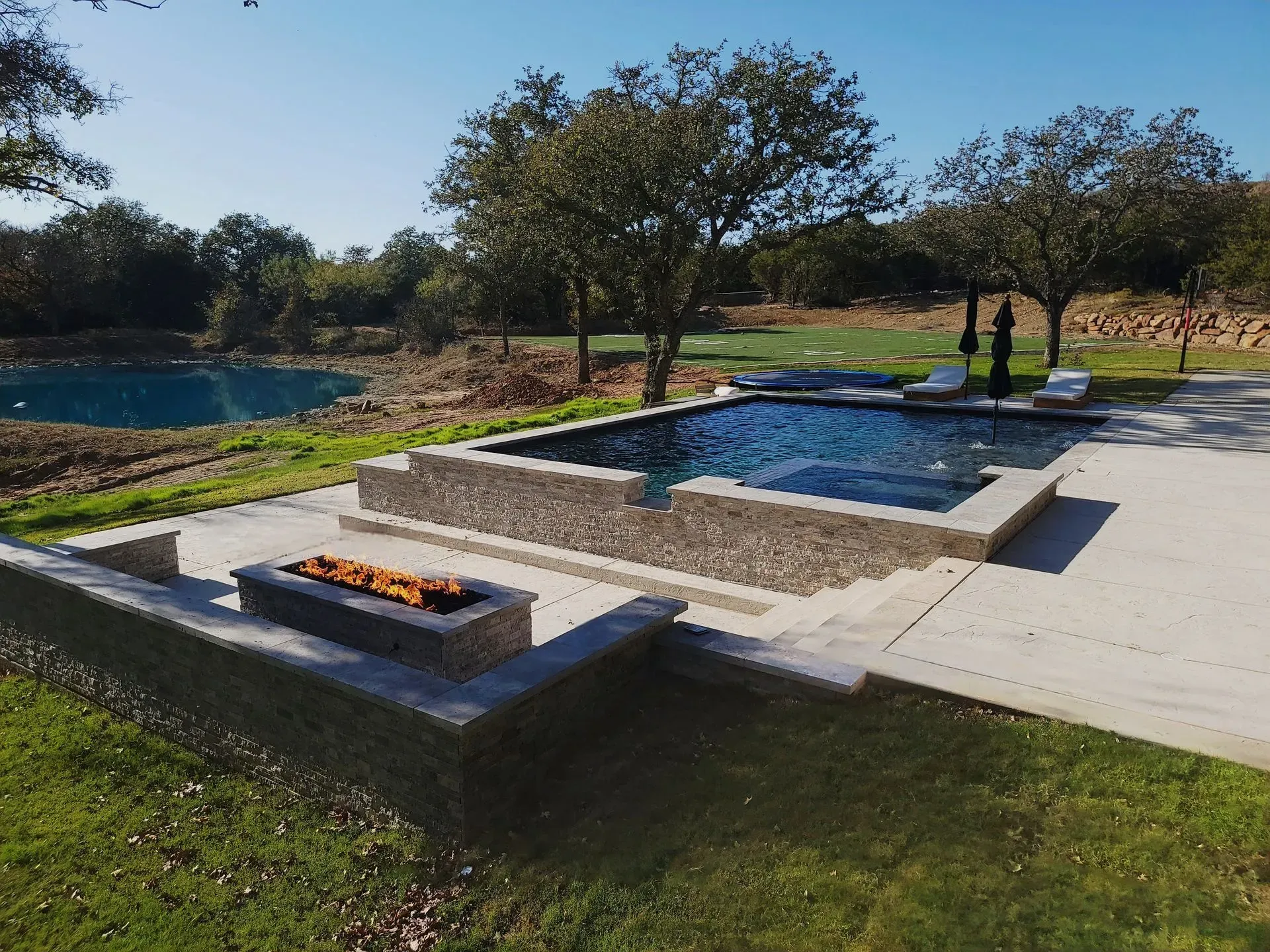 Rural pool with a firepit in Santo, TX